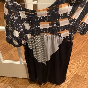 Blue top , longer in the back